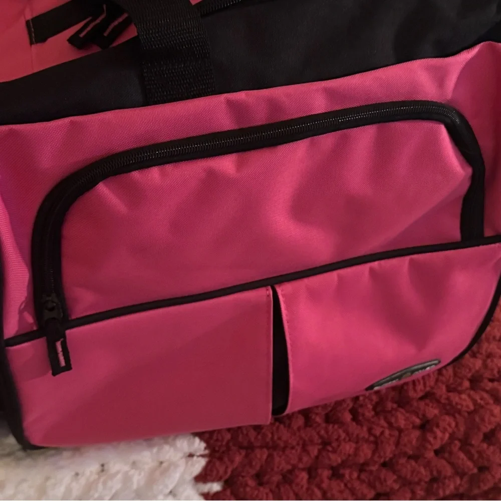 Pink and Black Garment Bag with Wheels 30” long• 16” wide• 14” high